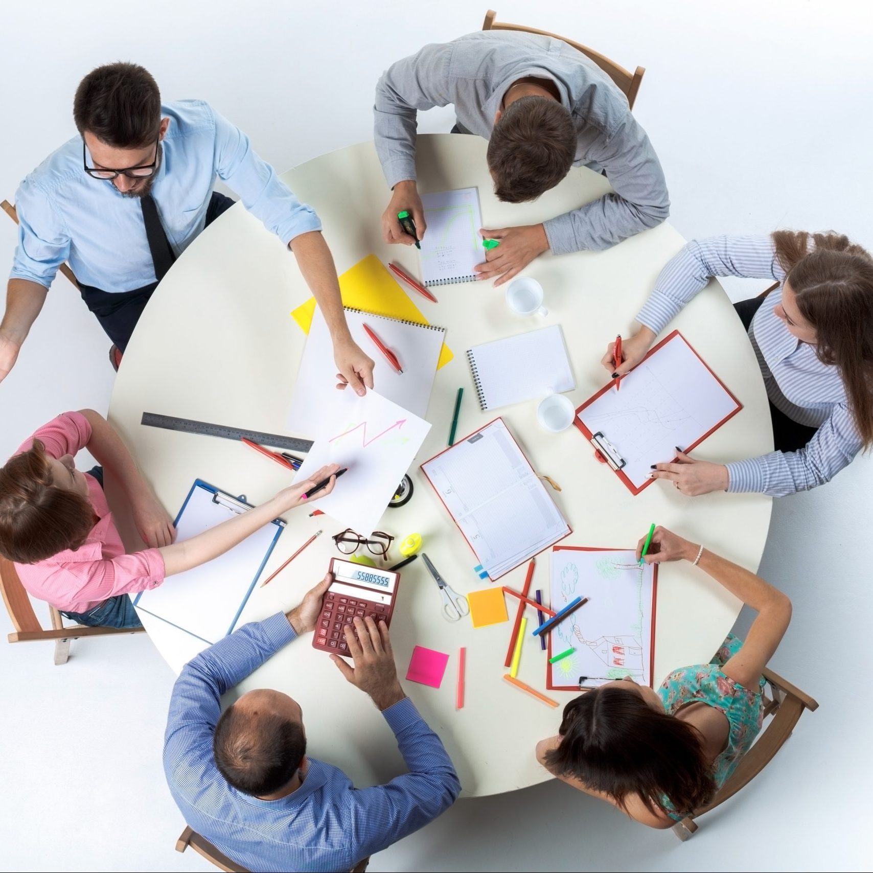Top view of business team, sitting at a round table on white background. concept of successful teamwork